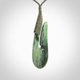 Hand carved jade matau pendant